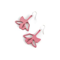 Rose colour wooden lily earrings on table