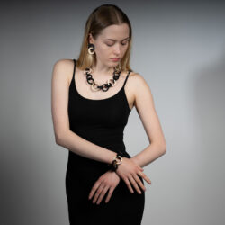 Woman wearing wooden chain necklace and bracelet