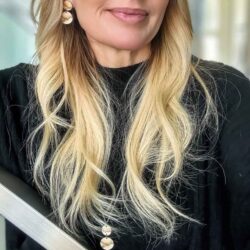 Blond woman wearing Northern lights jewellery