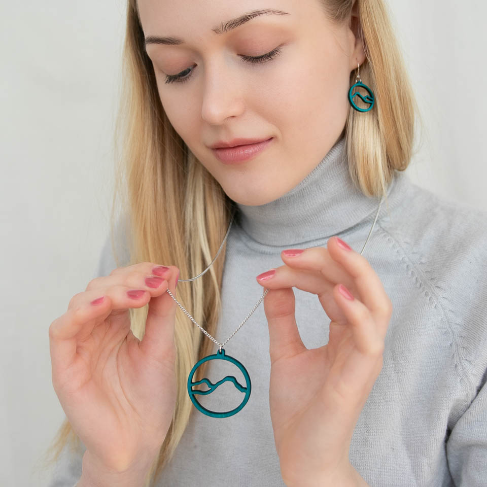 Wooden mountain earrings in turquoise colour