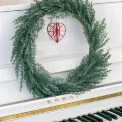 Red wooden heart by the piano